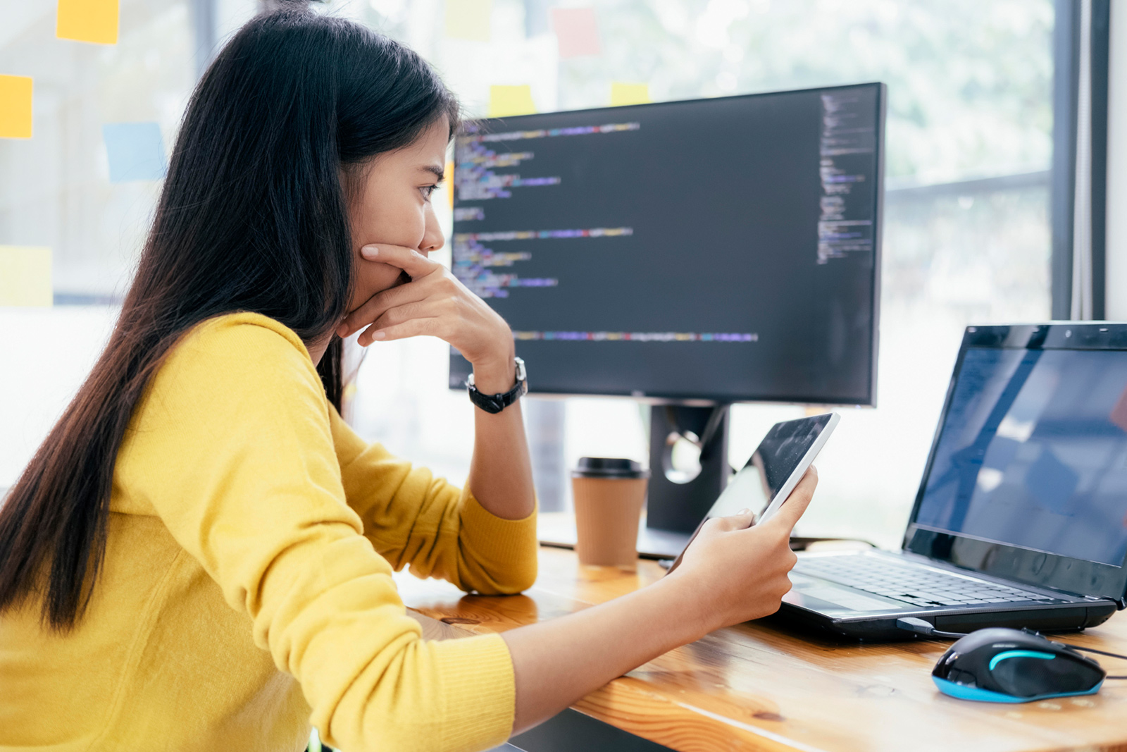 women sitting at the office with computer and tablet