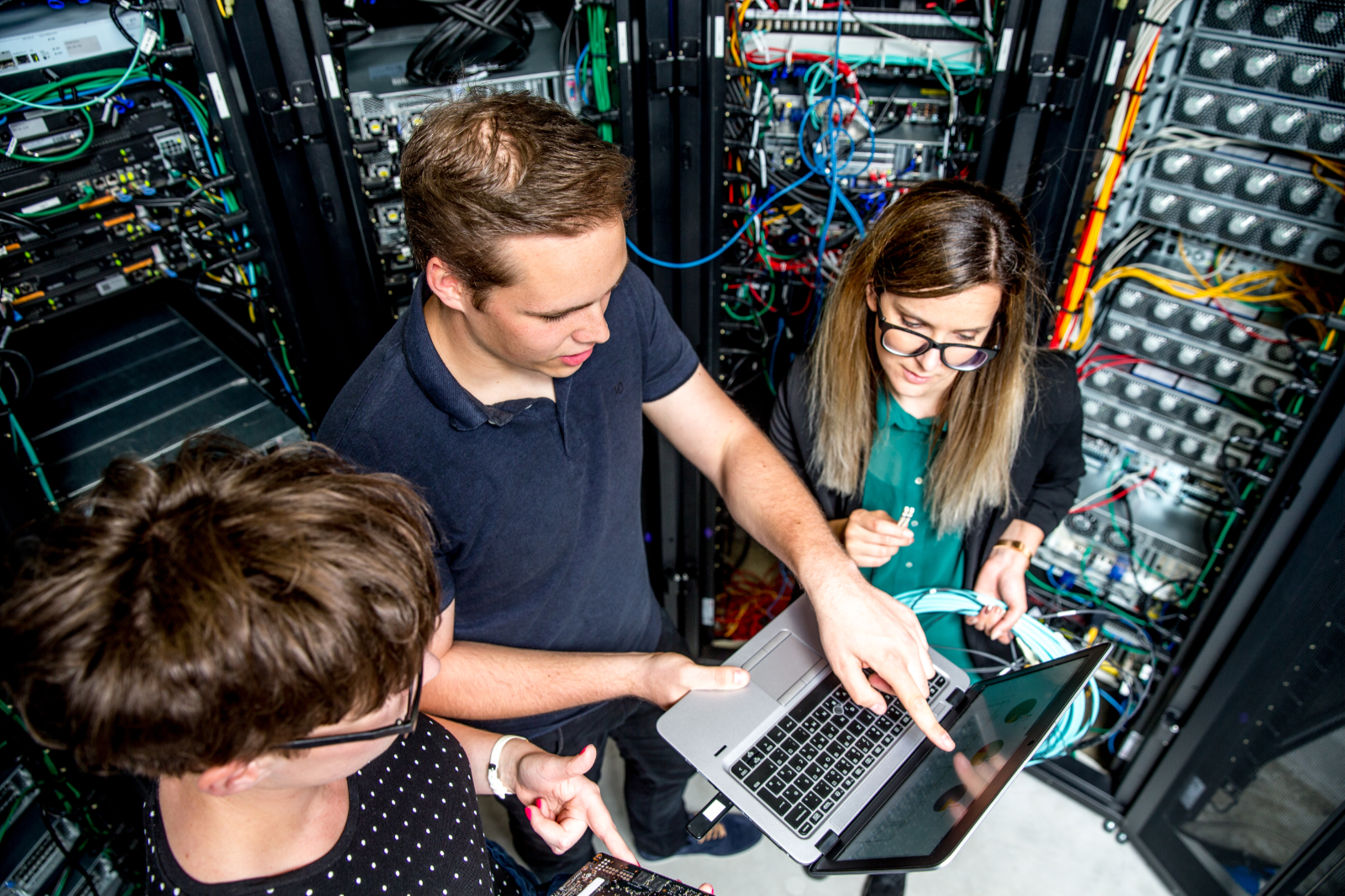 Three people are programming