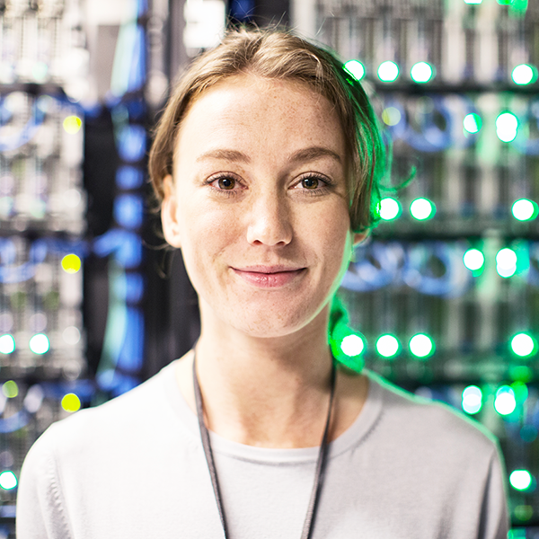 Portrait of a woman standing in front of IT servers