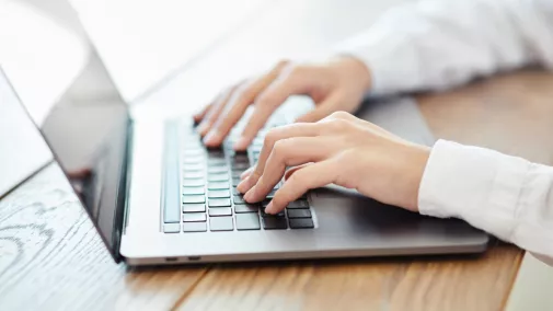 women hands working on a table with tablet