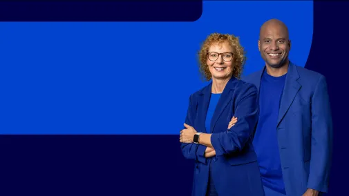View of two employees against a blue background.