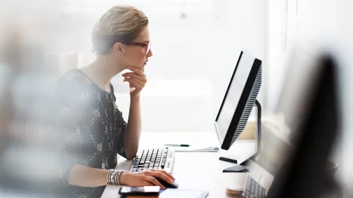 Woman working on computer in the office