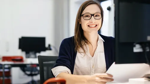 Woman at the computer in the office