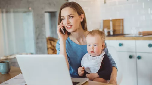 women sitting at home with child working with smartphone and notebook women child notebook smartphone at home