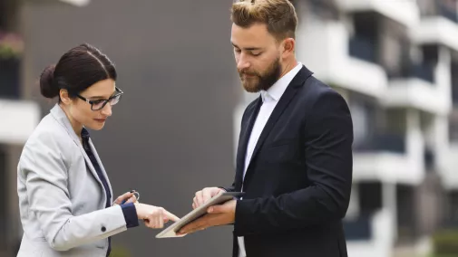 women man digital signing with tablet outside women man digital signing with tablet outside