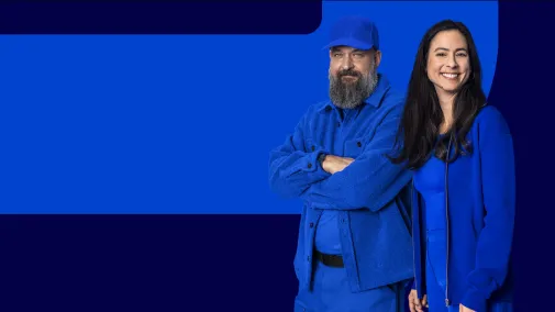 View of two employees against a blue background.