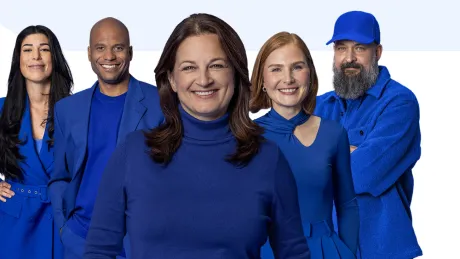 Employees look into the camera