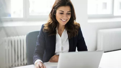 Business woman working at a laptop