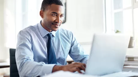 Businessman works on the laptop