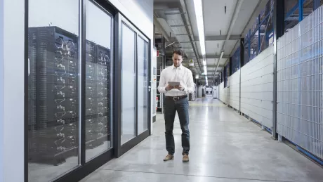 man with tablet in serverroom