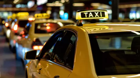 Taxis are waiting at the taxi stand