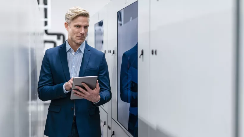 businessman holding tablet 