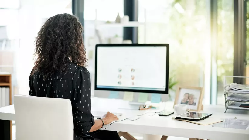 Woman working at the computer in the office